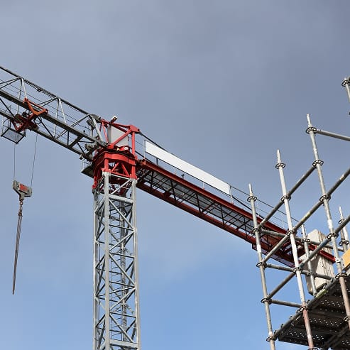A crane at a TOFCON construction site in Ottawa, showcasing ongoing commercial development.