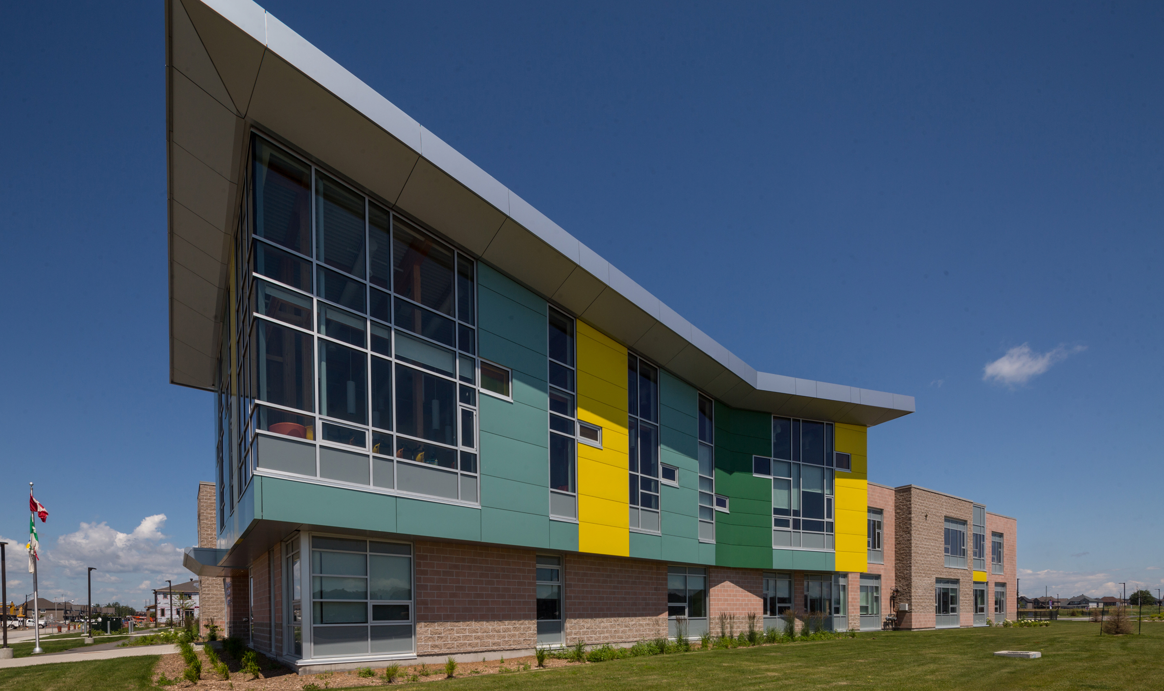 Vibrant exterior of Notre-Place Catholic Elementary School, highlighting TOFCON's construction work.