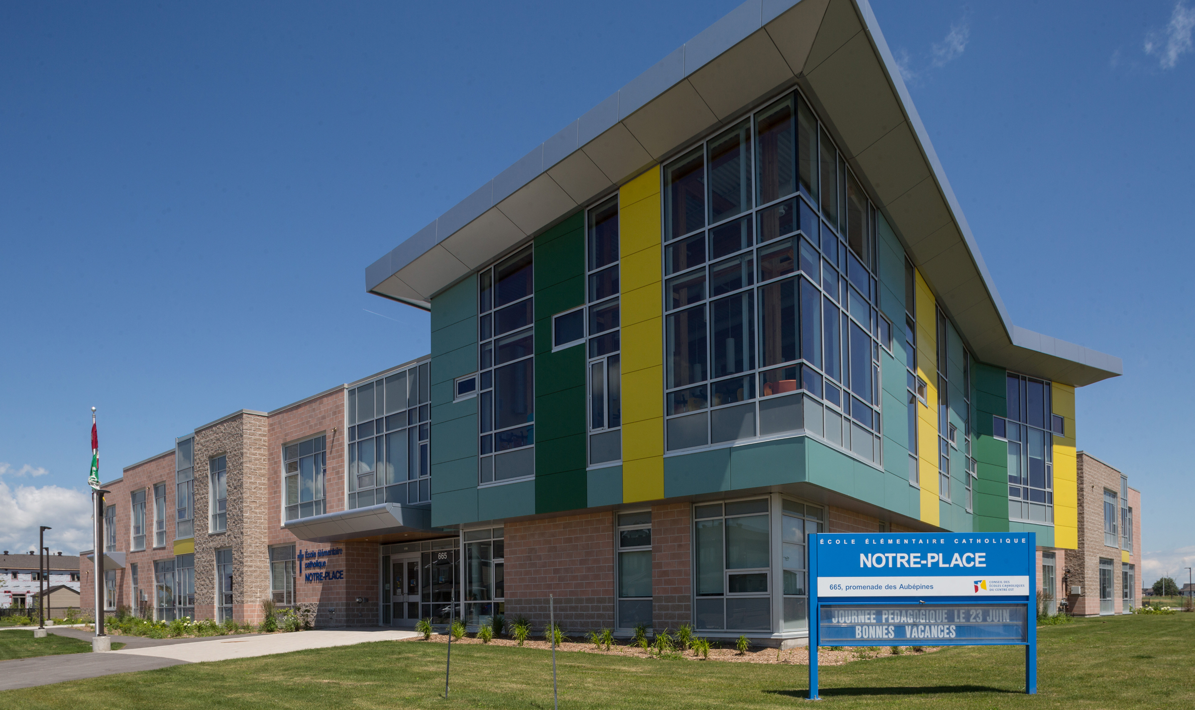 Vibrant exterior of Notre-Place Catholic Elementary School, highlighting TOFCON's construction work in Ottawa.