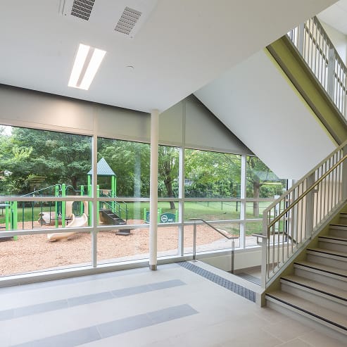 A stairway leading to a playground, highlighting TOFCON's post-construction services in Ottawa.
