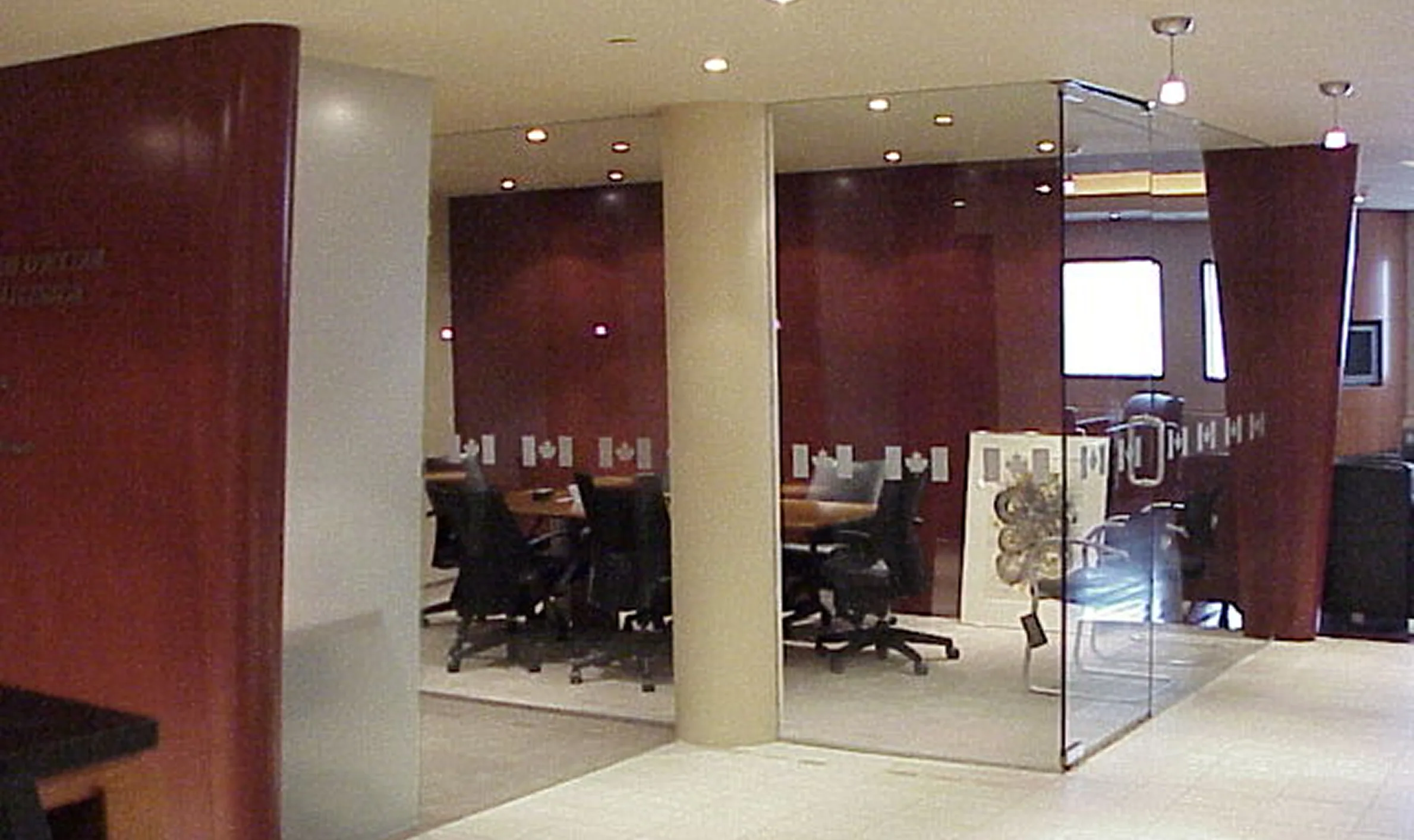 A modern reception area featuring a desk and chairs, designed for the Government of Canada by TOFCON in Ottawa.