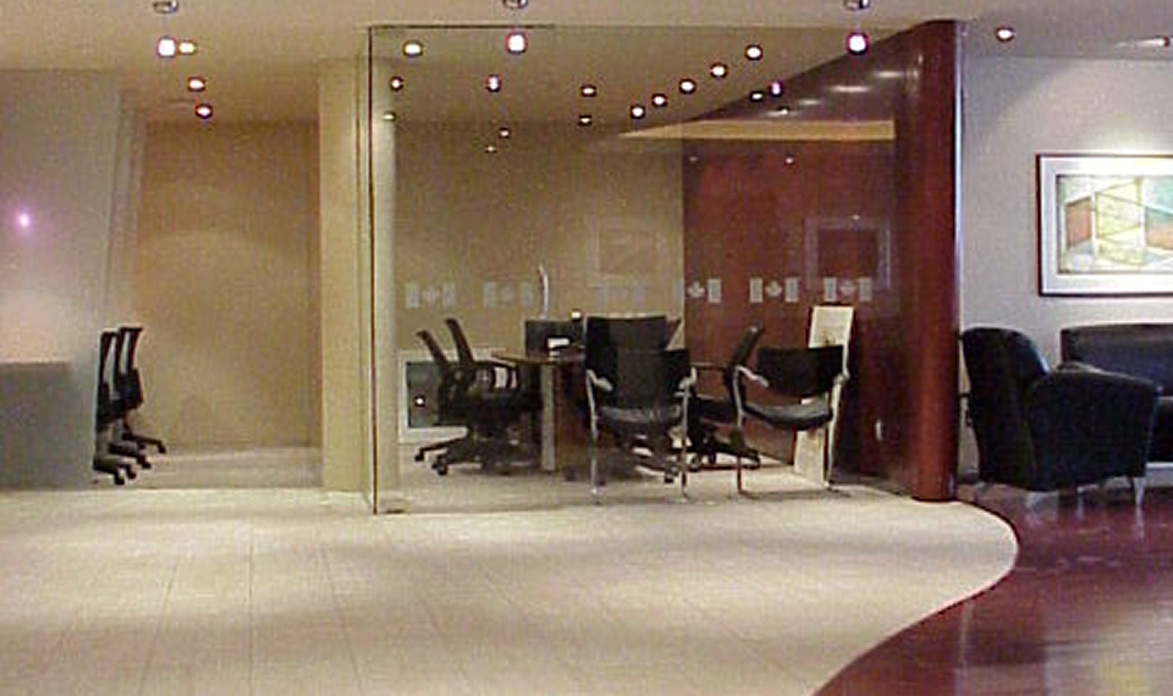 A spacious office featuring a large conference room with multiple chairs, designed for the Government of Canada's reception centre.