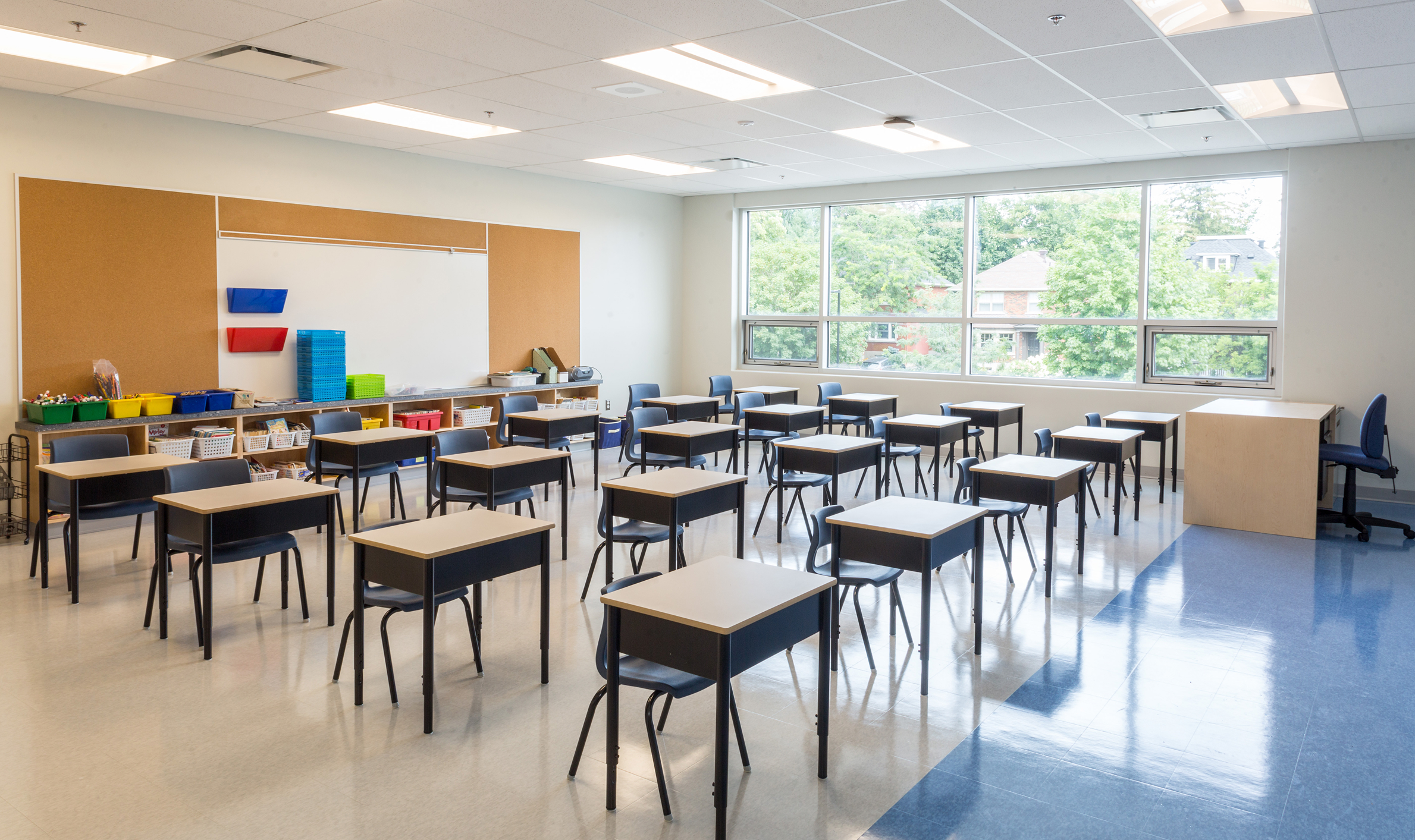 Newly furnished classroom with desks and chairs, highlighting TOFCON's construction project at Elmdale Public School.