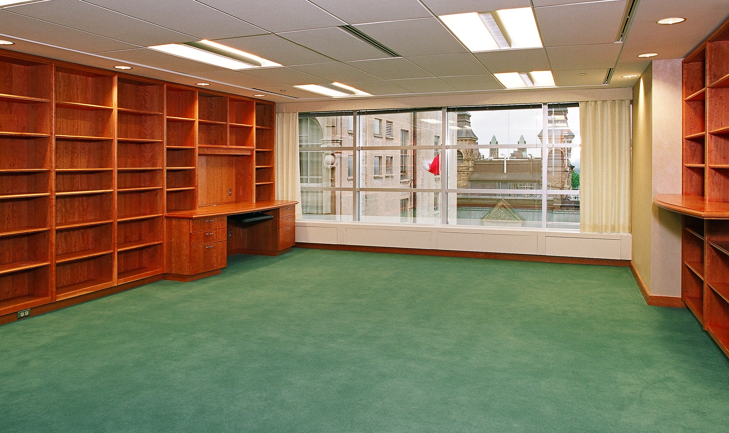 A spacious room with a desk and multiple bookshelves, representing TOFCON's construction efforts for the Federal Court of Appeals.