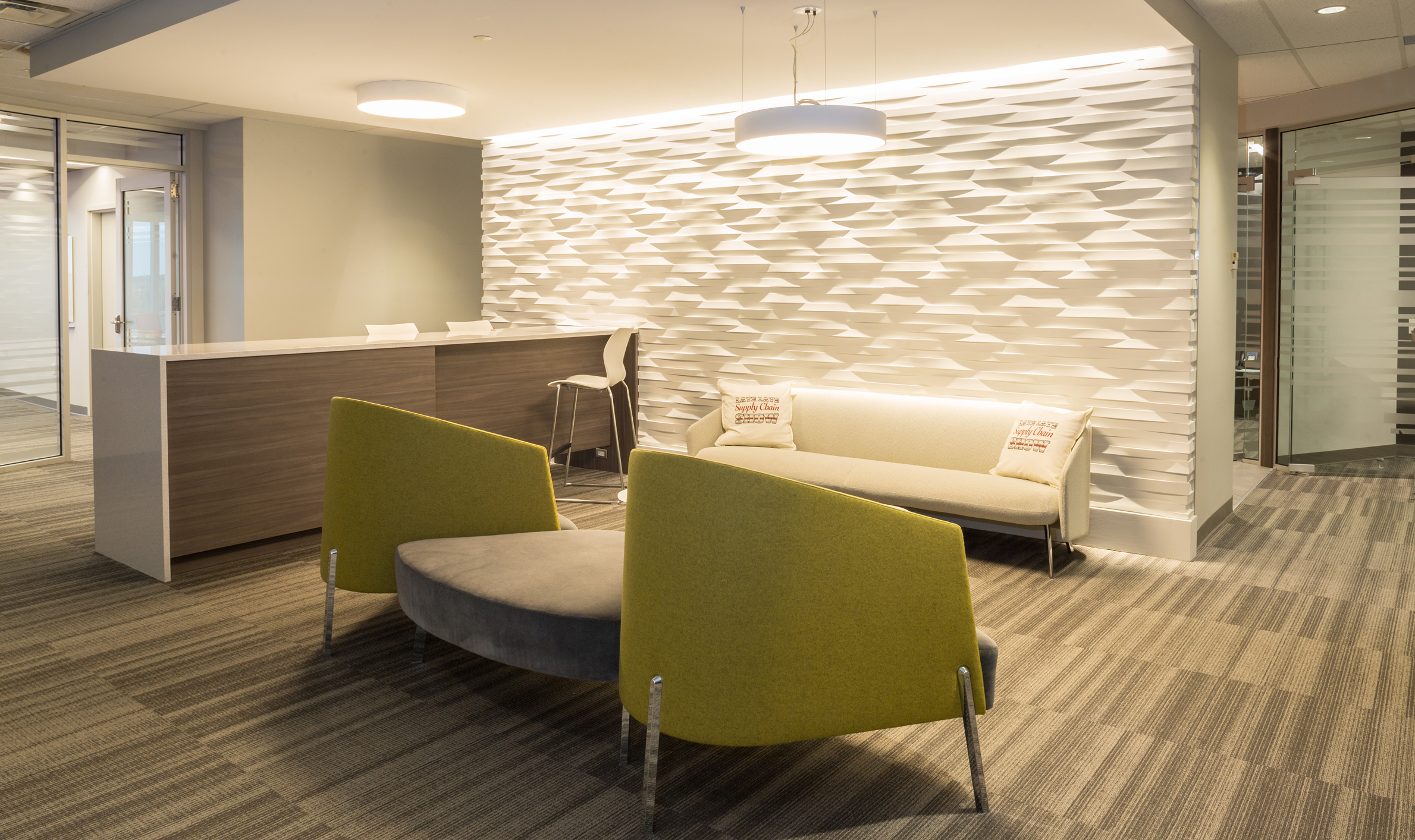 Stylish office reception with seating, representing TOFCON's construction efforts for Kinaxis in Ottawa.