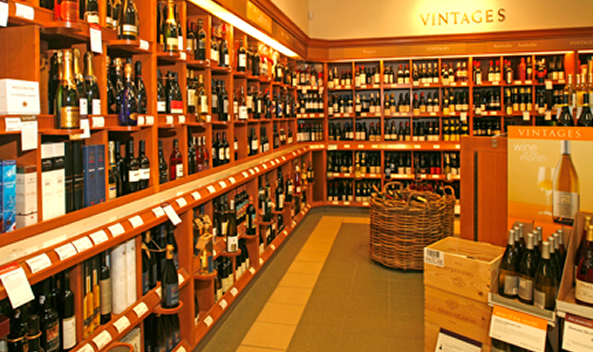 Wine store interior featuring shelves filled with various bottles, showcasing TOFCON's construction work for LCBO on Bank Street.