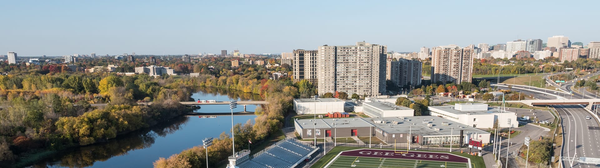 Overhead view of the U-Ottawa Gee-Gees football field and river, representing TOFCON's construction project in Ottawa.