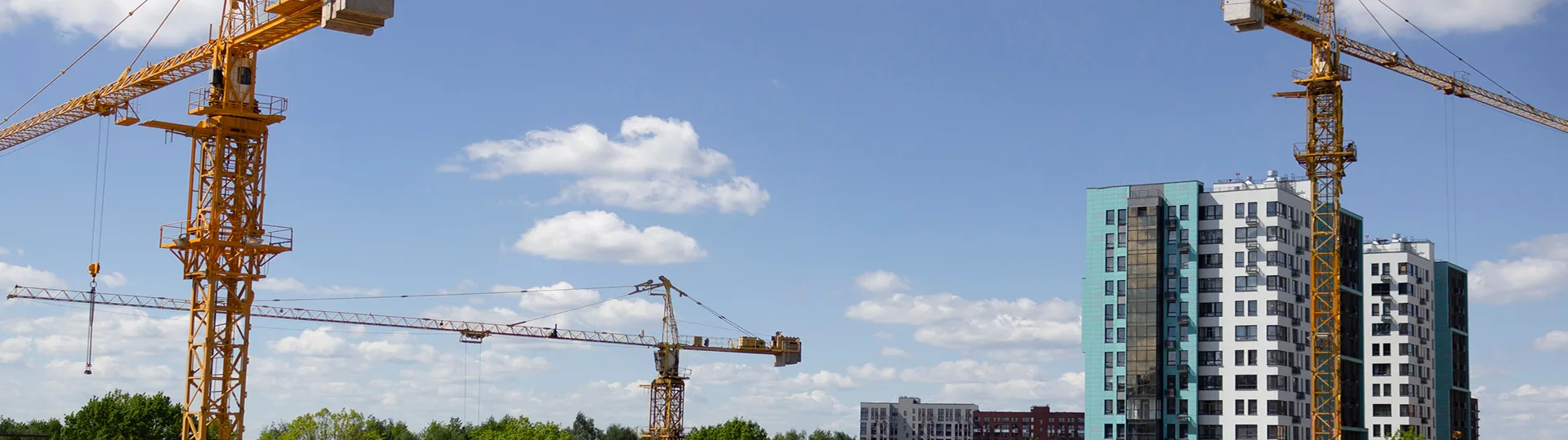 An active construction site in Ottawa with a crane and a developing commercial building, representing TOFCON's work.