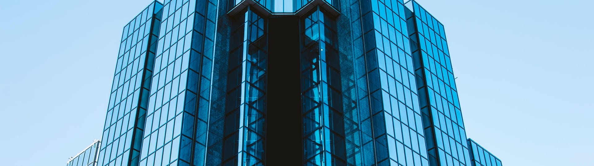 A towering structure with a clock, showcasing TOFCON's role in Ottawa's commercial construction landscape.